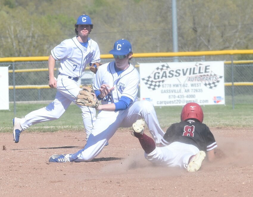 Cotter second baseman Wesley Perkey attempts to tag Life Way Christian's Micah Quinn on a steal attempt as shortstop Kolby Vinson backs him up on Friday.