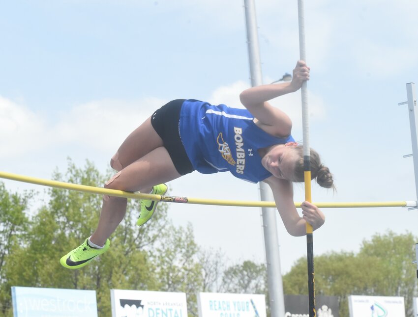 Mountain Home's Makenna Miller attempts to clear 8 feet, 8 inches in the pole vault during the NEA Junior High Conference meet on Monday at Bomber Stadium.