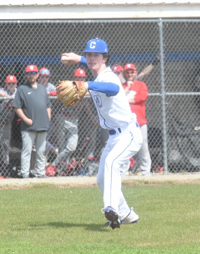 Cotter pitcher Kolby Vinson throws to first base during a recent home game.