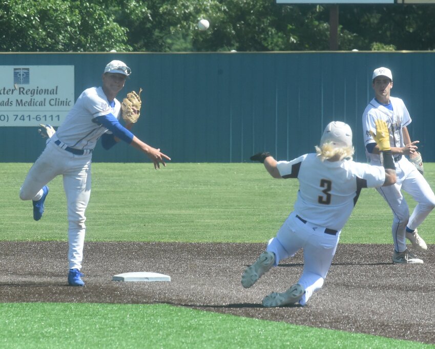 Mountain Home's Dawson Dunlap (left) and Finley Chafin turn a double play as Lake Hamilton's Kohen Manley (3) slides into second base Thursday during the Class 5A State tournament at Harrison.