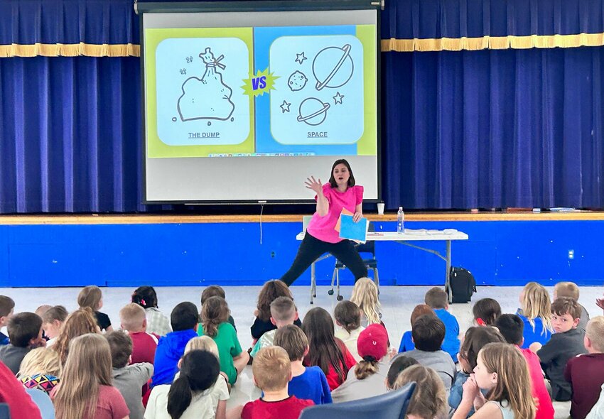 Mountain Home alum Jennifer Gentry, a writer and illustrator, speaks to children at Nelson-Wilks-Herron Elementary School. Gentry shared her newly published children&rsquo;s book&nbsp;&mdash; &ldquo;Shoes On&rdquo; &mdash; to students at three area schools this week.   Caroline Spears/The Baxter Bulletin
