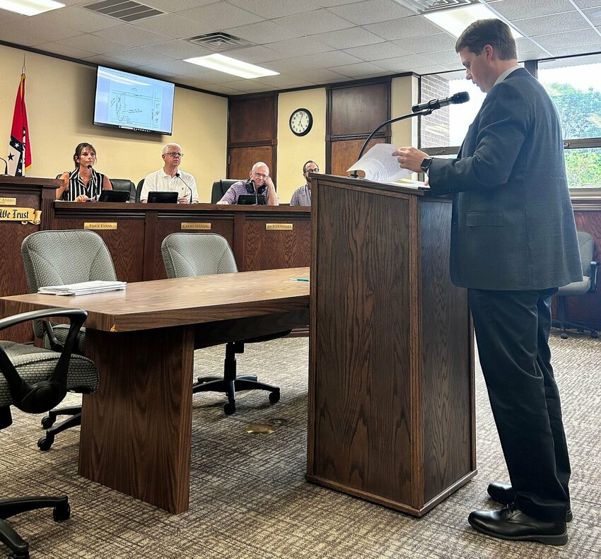 Attorney Robert Clarke (right) addresses members of the Mountain Home City Council on Thursday evening. Clarke's presentation regarding the rezoning of property located between Arkansas Avenue and Coley Drive was approved.   Caroline Spears/The Baxter Bulletin