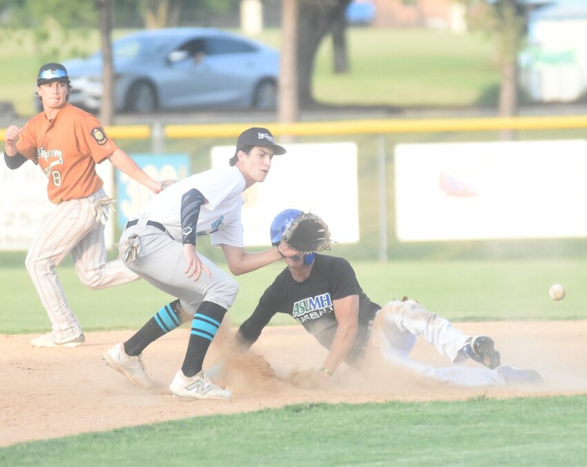 Logen Walker of the Mountain Home Lockeroom alumni team steals second base as Lockeroom shortstop Finley Chafin and second baseman Lincoln Sherry run to the bag on Saturday at Cooper Park.