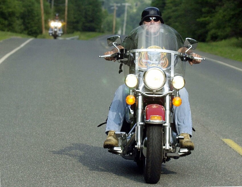 In this AP File photo, a man rides his motorcycle on a rural highway. The Twin Lakes Area, along with most of Northwestern Arkansas, is known for its challenging rides on scenic highways. Motorcycle safety in the area always is important, but summer weather brings out the riders in droves, especially as a weekend activity.   Nathan Martin/AP File Photo
