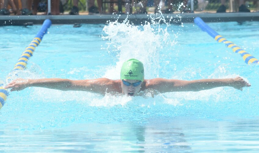 Mountain Home's Ajay Reiss swims the butterfly during an individual medley Saturday at Cooper Park.