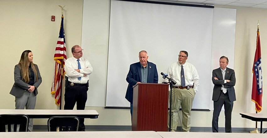 Shauna Isbell (from left) and Brent Jones of the Boone County's Criminal Investigations Division, join Boone County Sheriff Roy Martin and Capt. Bob King alongside 14th Judicial District Prosecuting Attorney, David Ethredge, at a press conference about the Rocky Dodson second-degree murder charge held on Friday, May 17.   Loretta Knieff/Harrison Daily Times