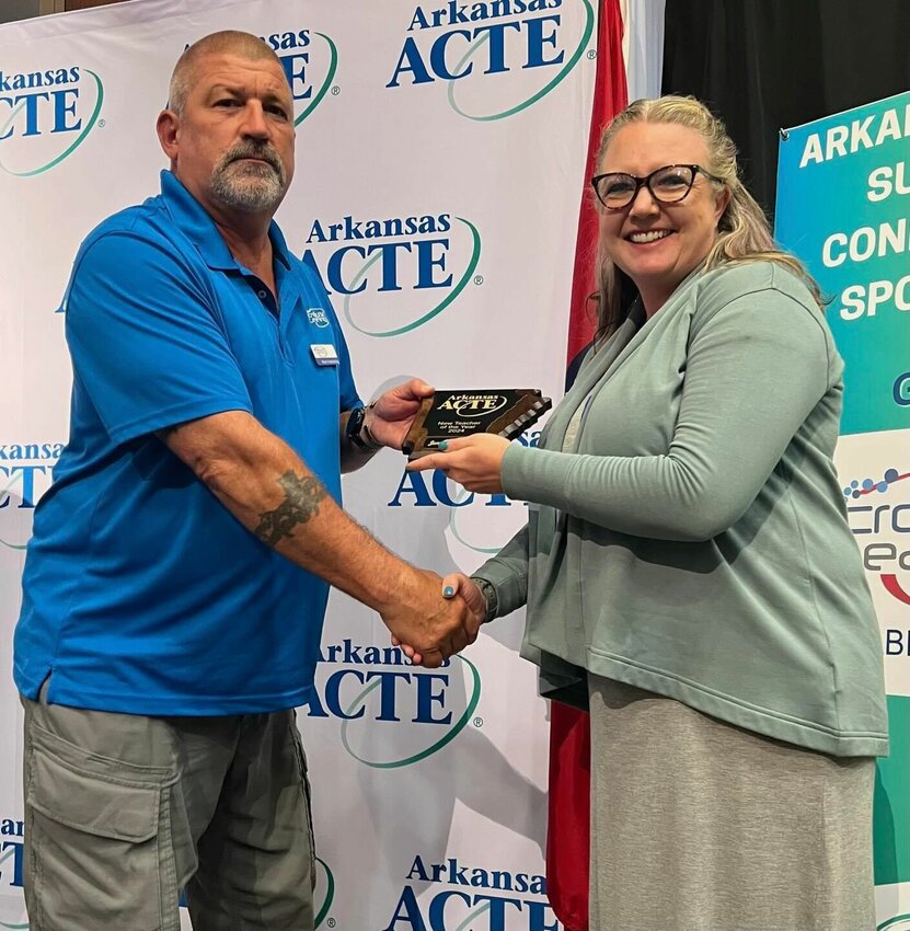 Jennifer Holmes (right), a career and technical education teacher at Mountain Home Junior High, recently was honored as the Arkansas ACTE Teacher of the Year.   Submitted Photo