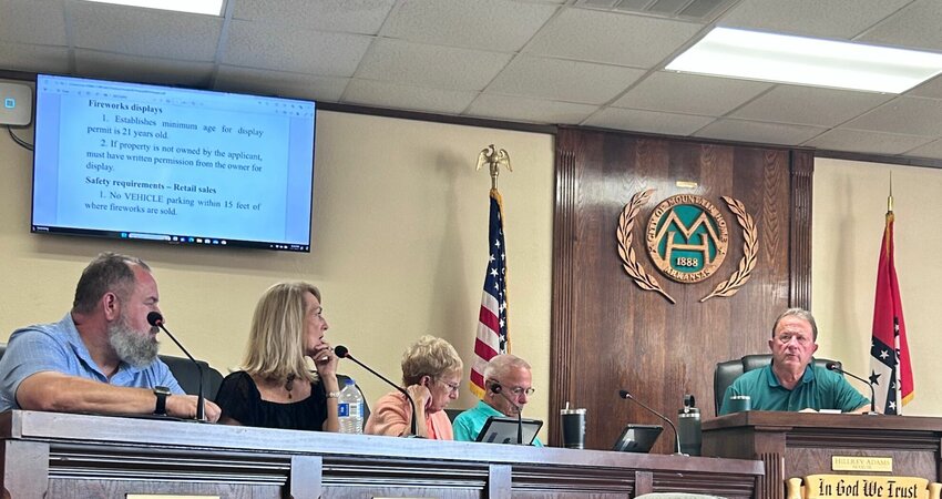 Members of the Mountain Home City Council, along with Mayor Hillrey Adams, listen Thursday evening during the council's regular monthly meeting.   Caroline Spears/The Baxter Bulletin