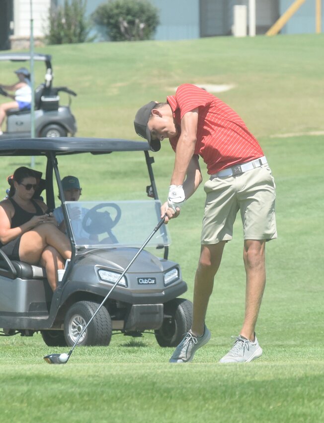 Flippin's Hudson Lindsey tees off on the 10th hole Monday during the Ultimate Auto Group Invitational at Big Creek Golf & Country Club.