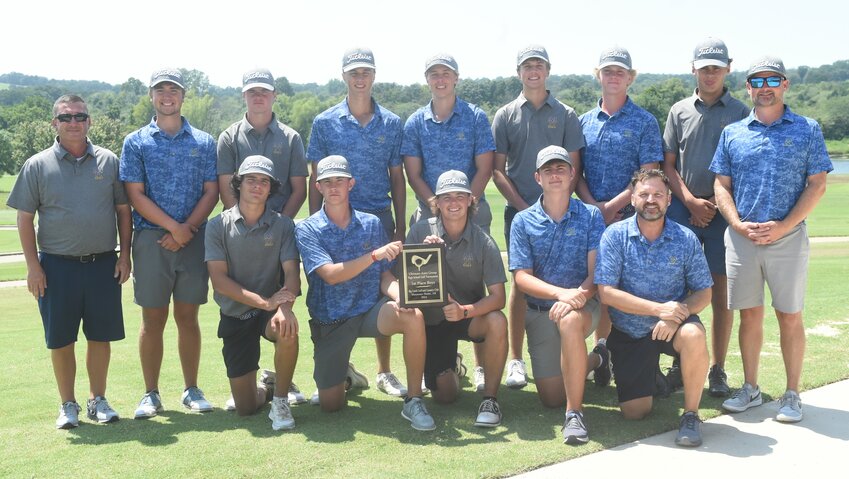 Mountain Home players and coaches pose with the championship trophy of the Ultimate Auto Group Invitational golf tournament on Tuesday at Big Creek Golf & Country Club.