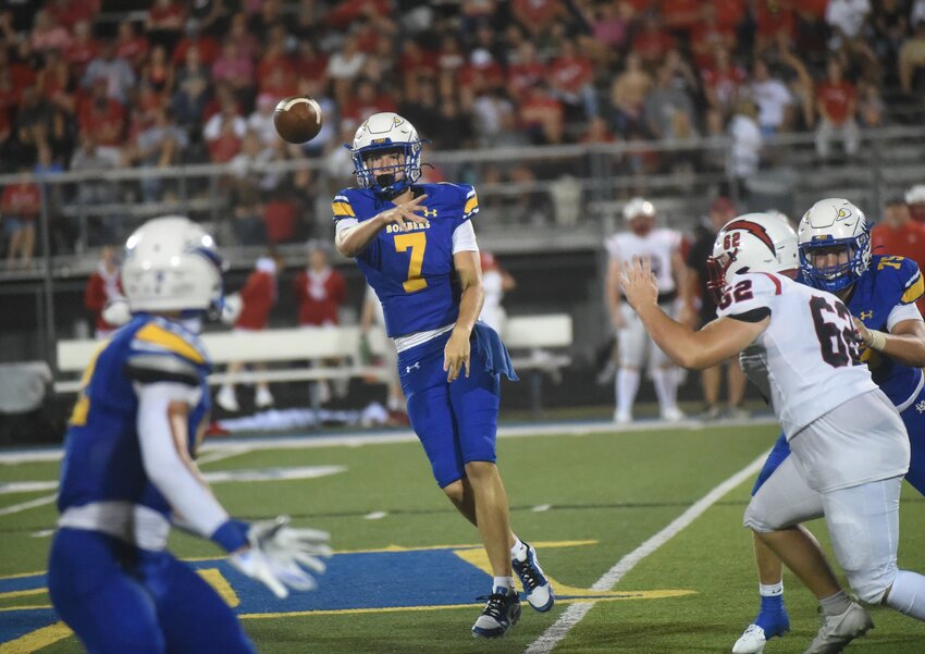 Mountain Home quarterback Brantlee Phillips (7) passes during the Bombers' season-opening win vs. West Plains. Mountain Home received the sixth most votes in Class 6A in the most recent statewide media poll. The Salem Greyhounds are ranked fourth in Class 3A.