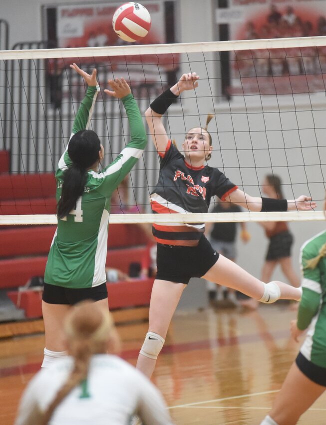 Flippin's Autumn Loomis tips over Valley Springs' Jayden Berry (14) on Thursday at Bobcat Country.