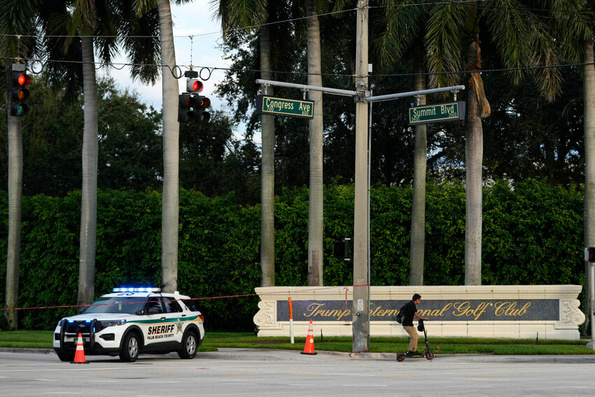 A vehicle with the Palm Beach County Sheriff's office is parked outside of Trump International Golf Club after the apparent assassination attempt of Republican presidential nominee and former President Donald Trump, Monday, Sept. 16, 2024, in West Palm Beach, Fla. (AP Photo/Lynne Sladky)