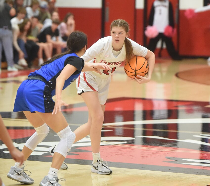 Norfork's Maggie Tyrone is defended by Mammoth Spring's Molly Corbett on Monday night in the Bobby D. Hulse Memorial Classic at Norfork. Tyrone and Corbett combined for 65 of the game's 98 points.