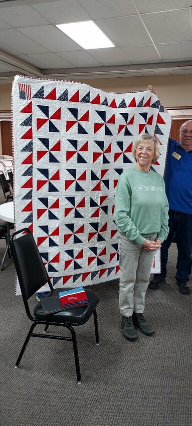 Roberta Schaper, a U.S. Marine Corps veteran, is shown with the quilt she received Jan. 13 from Mountain Home Quilts of Valor. 


Submitted Photo