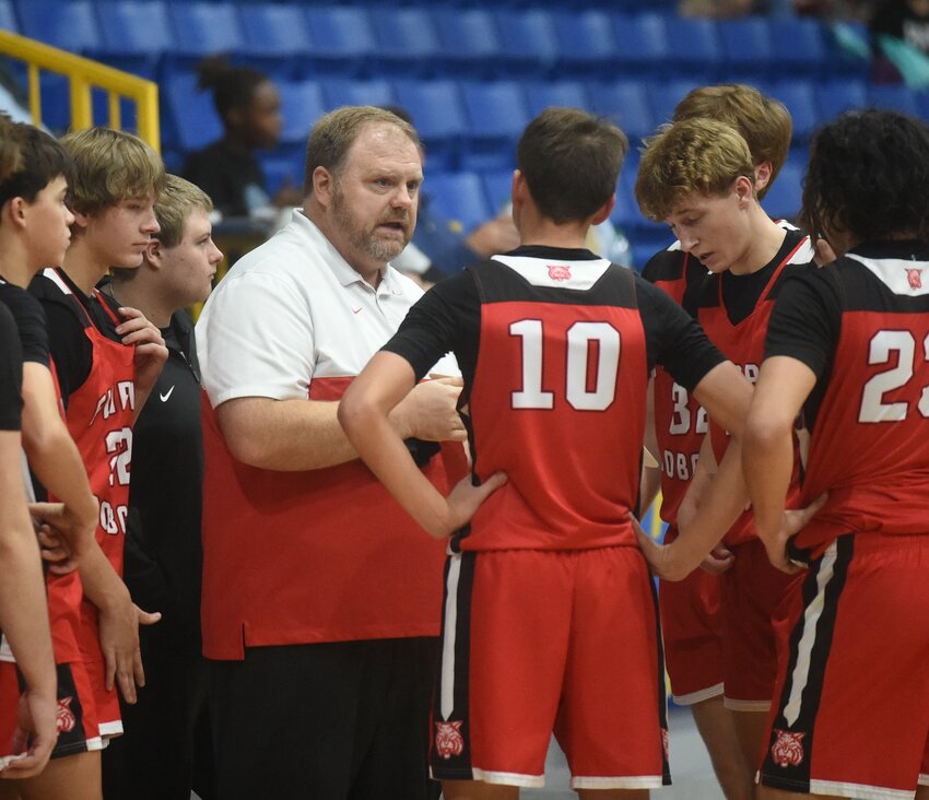 Flippin boys coach Josh Robins talks to his players during a timeout earlier this season. The Bobcats knocked off Melbourne in a 3A-2 Conference game Friday night.