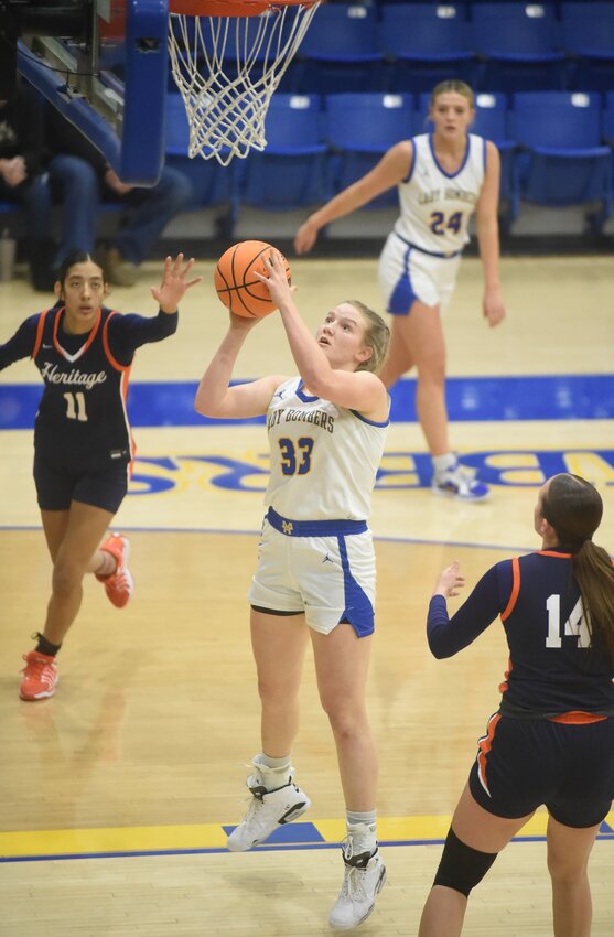 Mountain Home's Livi Fosness goes up for two during a recent home game. The Lady Bombers remain ranked No. 2 in Class 5A in the most recent state-wide media poll.