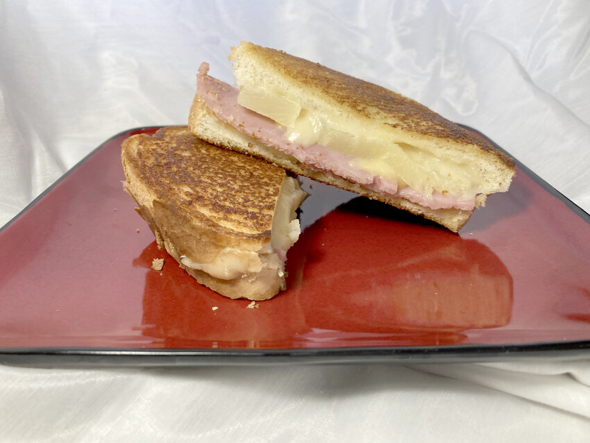 Hawaiian Grilled Cheese imparts the flavors of a Hawaiian Pizza in a sandwich.