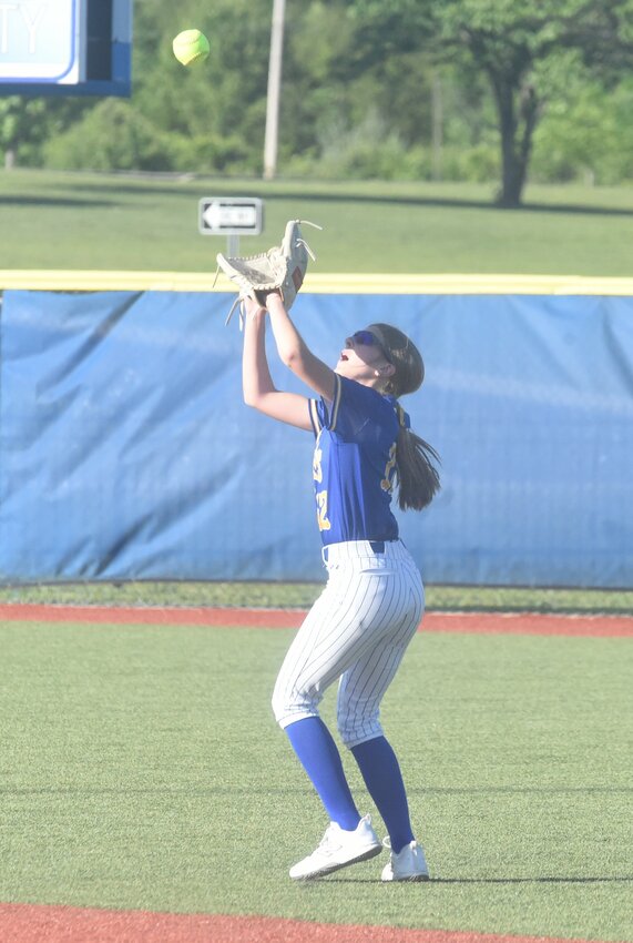 Mountain Home's Libby Dewey catches a pop-up against Rogers on Monday at McClain Park.