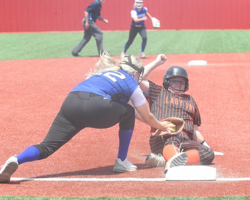 Cotter's Jadyn Tucker tags McCrory's Halliann Glover at third base during the Lady Warriors' 4-3 state tournament victory on Thursday at Palestine-Wheatley High School.