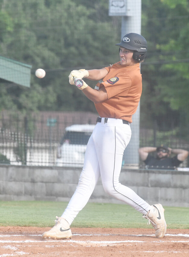 Lockeroom's Camden Payne swings at a pitch during a recent home game.
