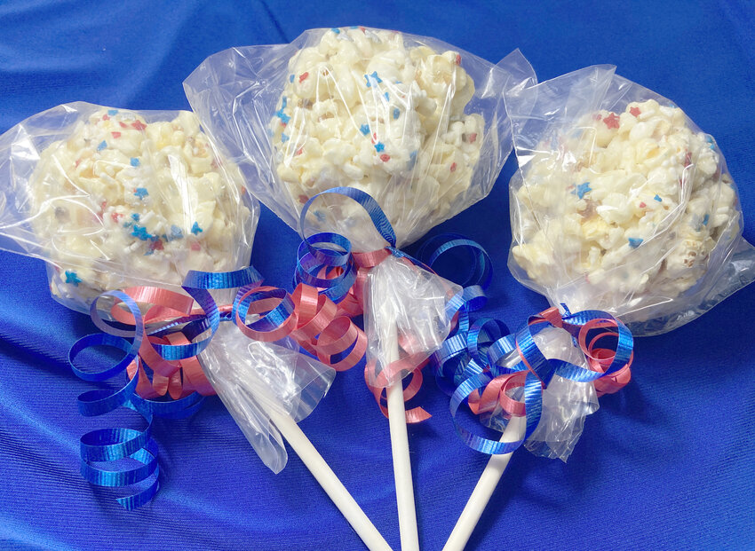 Patriotic Popcorn Pops are easy to make and portable holiday get-togethers.