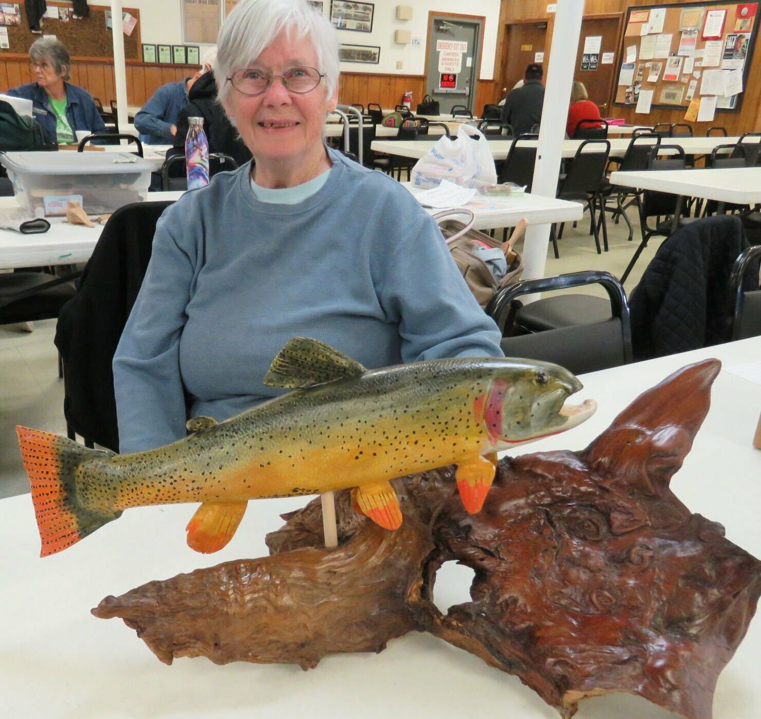 Sandra Shackelford displays trout carving | Baxter Bulletin