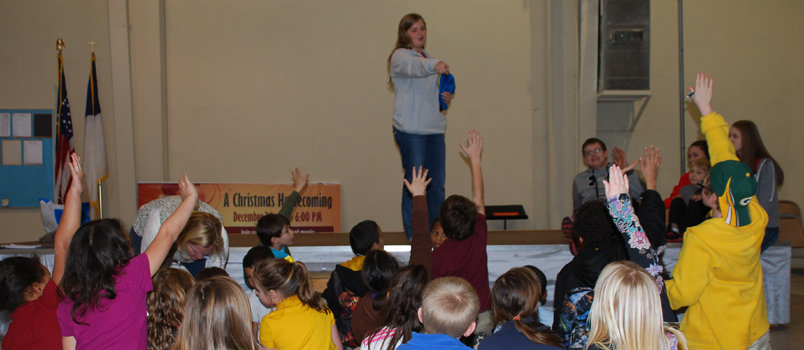 Reagan Christol of Burning Bush Baptist Church, Ringgold does a magic show for children at a community center.
