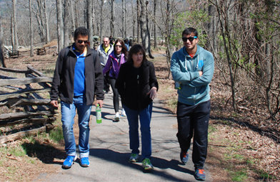 Omkar Mirgal, left, and Varun Bansal, both from India, walk with Georgia Baptist Convention state missionary Teresa Royall, who serves as the Baptist Collegiate Ministry director at Georgia State University in Atlanta. GARY KING/Special