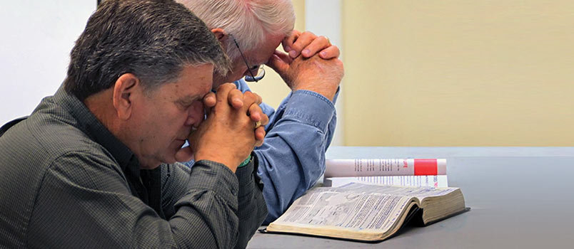 Chuck Hilling, front, and Steve Dyer participate in prayer during their men’s Sunday School class at Northeast Church in Braselton. Northeast Church was the fastest growing Sunday School in 2014 among medium-sized churches (200-399). BRYAN NOWAK/Special