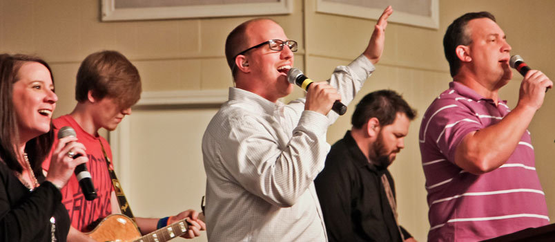 Stephen Folker, center, leads worship at Lawrence Drive Baptist Church where serves as the worship and missions pastor. Rebekah Clough/Special