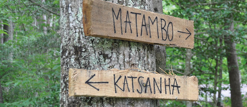Primitive road signs direct the campers to different “cities” in the woods of Pinnacle. JOE WESTBURY/Index
