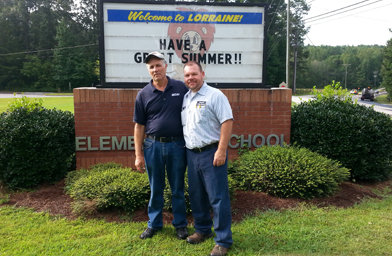 Mike Thomas, right, pastor of Highview Baptist Church in Stockbridge, stands with Mikhail Cheban, who works as a custodian at Lorraine Elementary School in Rockdale County. Cheban, from Moldova, and Thomas became friends in the Highview pastor's attempts to learn Romanian. MIKE THOMAS/Special