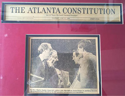 In this photo of an Atlanta Constitution clipping shared on his Twitter account, SBC parliamentarian Barry McCarty stands on stage with Atlanta pastor Charles Stanley, Jimmy Draper, and John Sullivan at the 1986 SBC annual meeting, held in Atlanta. The convention, McCarty’s first as parliamentarian, came amid the Conservative Resurgence and was remembered by McCarty as “very, very intense” in a June 2006 Baptist Press article. BARRY MCCARTY/Special