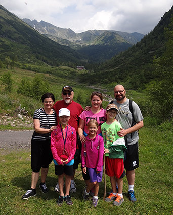 Emir and Hanna Caner stand amid the Vysoke Tatry Mountains in Slovakia with Hana’s parents, Vera and Jan Titera. The Caner children in front, left to right, are Daniela, 10, Anna, 8, and John Mark, 12. CANER FAMILY/Special