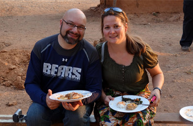 Emir and Hana Caner enjoyed the guest-of-honor treatment at a Zambian village with a feast consisting of chicken, potato leaves, and peanut butter with potatoes and rice. 