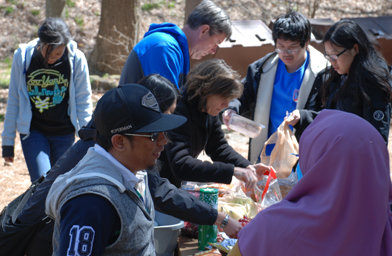Teresa and Bob Royall, center, work to serve lunch for Georgia State University Baptist Collegiate Ministry participants who participated in a recent outing to hike Kennesaw Mountain. Teresa serves as the Baptist Collegiate Ministry director at Georgia State University. GARY KING/Special