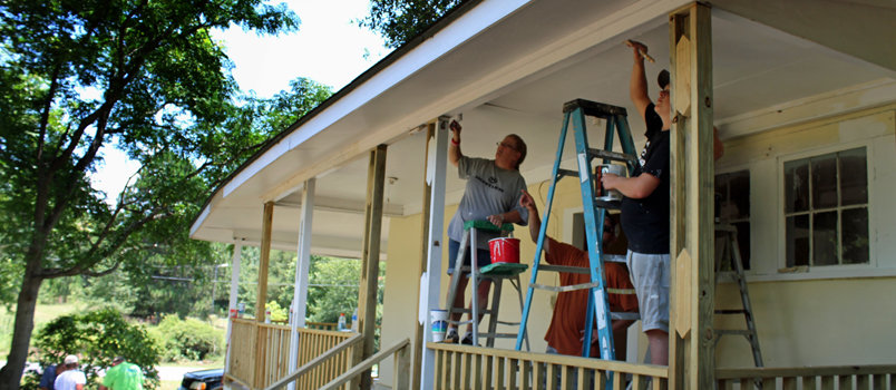 Gresston Baptist Church volunteers work on a porch for one of their SPLASH projects, the church’s annual community service mission event. JENNIFER LEE/Special
