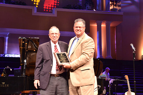 Harry Eskew of Macon was presented the Lifetime Achievement Award by the Georgia Baptist Church Music Conference (GBCMC) during their recent meeting at North Metro Baptist Church in Lawrenceville. He retired after serving as professor of music history and hymnology at New Orleans Seminary for 36 years. He has written several books on hymnology and served as a member of the committees for the Baptist Hymnal 1975 and Baptist Hymnal 1991. He is also an expert in shape-note hymnody and continues involvement with singing conventions and hymnology events, including the Sacred Harp Singing Convention held each year in Macon. He is pictured with Rob Hobby, right, outgoing president of the GBCMC. Warren Rogers, associate pastor of worship/administration at First Baptist Church of Perry, was elected GMCMC president. EDDY OLIVER/Special 