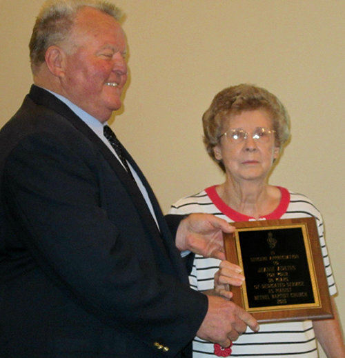 Members of Bethel Baptist Church near Cordele gave pianist Jeanie Adkins a surprise July 19 in recognizing her 58 years of service. Pictured with her is Jim Cox, Bethel’s pastor. 