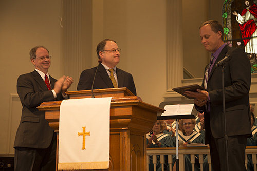 Left to right, Georgia Baptist Convention archivist Charles Jones and GBC Cooperative Program/Stewardship's Scott Preissler, representing GBC Executive Director J. Robert White, present First Ringgold Pastor Eric Kennedy with a plaque commemorating the 175th anniversary of the church.