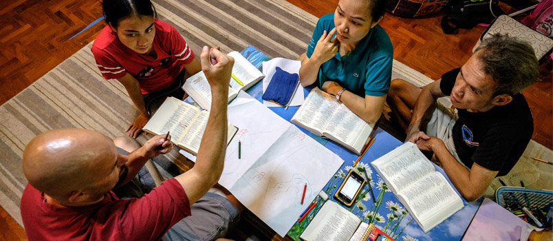 IMB missionary Jon Valjean (name changed) teaches a group of Deaf Thais how to craft stories from the Bible. HUGH JOHNSON/IMB 
