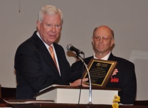 GBC Executive Director J. Robert White presents a plaque honring the church for its 47 years of ministry. Dwayne Boudreaux, associational missionary for Augusta Association Baptist churches, stands to the right. JOE WESTBURY/Index