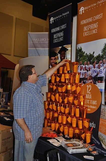 Georgia Baptists’ three educational institutions – Shorter University, Truett-McConnell College, and Brewton-Parker College – are well represented at this year’s annual meeting. Peter Faulkner, vice president of development at Mount Vernon-based Brewton-Parker, gently balances a stack of plastic cups being given away at his booth. JOE WESTBURY/Index