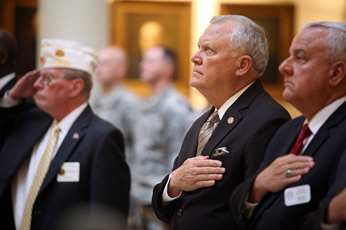 Georgia's Nathan Deal, shown here at a Veterans Day ceremony Oct. 28, is among more than half of the nation's governors protesting the relocation of Syrian refugees to his state amid concerns of terrorism. PHOTO/gov.georgia.gov