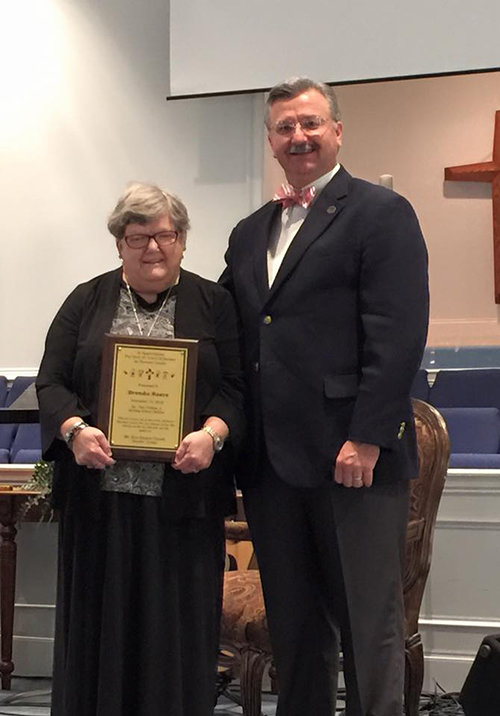 Gary Nobles, Jr., Sunday School director for Mt. Zion Baptist Church in Danville, presents Brenda Reece with an award on Nov. 15 for more than 45 years of service in the church nursery.
