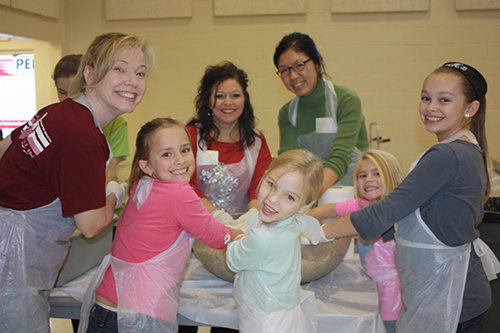 Members of First Baptist Church in Duluth prepare an annual Thanksgiving meal delivered to local families. FB DULUTH/Special