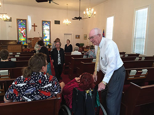 Pastor Paul Melton greets members before the morning service at Ohoopee. The 78-year-old Georgia native has served smaller churches as a bivocational pastor since 1963. He just completed his second decade at the Washington County church. JOE WESTBURY/Index