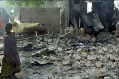 A young boy walks amid the ruins of Dalori village after Boko Haram killed at least 86 there in a Jan. 30 raid, burning children alive. Screen capture of CNN report.