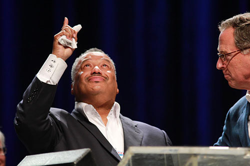 Franklin Avenue Baptist Church pastor Fred Luter Jr. points to heaven at his 2012 election as president of the SBC, the first African American to hold the post. At right is outgoing president Bryant Wright. BP file photo